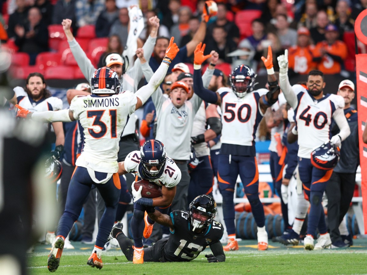 Denver Broncos cornerback KWaun Williams (21) intercepted the ball from Jacksonville Jaguars quarterback Trevor Lawrence (16) (not pictured) in the fourth quarter during an NFL International Series game at Wembley Stadium.